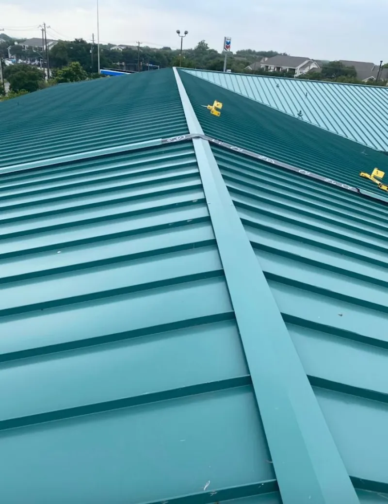 Green commercial metal roof ridge and valley for Metal Roof Repair in Fairfax